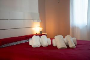 Postel nebo postele na pokoji v ubytování PALAZZO ENNIO