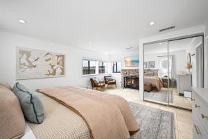 a bedroom with a bed and a living room at 1313 S Coast Hwy in Laguna Beach