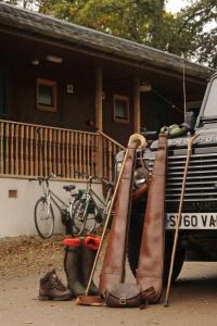 a pile of luggage and boots on the back of a truck at Ballathie House Hotel in Perth