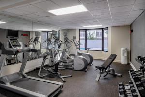 a gym with treadmills and elliptical machines at Courtyard by Marriott - Naples in Naples