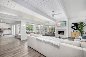 a living room with a couch and a fireplace at Spacious Home with 7 Beds minutes from Mission Bay in San Diego