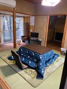 a bed sitting on the floor in a room at J's Select & Lodge - Vacation STAY 16052 in Kumano