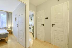 Posteľ alebo postele v izbe v ubytovaní Apartament Dzień Dobry 2