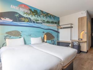 Postel nebo postele na pokoji v ubytování B&B HOTEL Fort-de-France