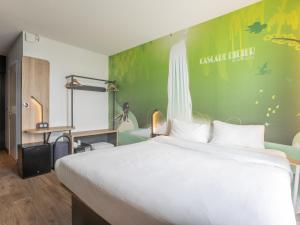 Postel nebo postele na pokoji v ubytování B&B HOTEL Fort-de-France
