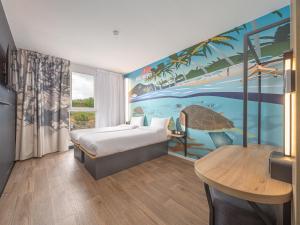 Postel nebo postele na pokoji v ubytování B&B HOTEL Fort-de-France