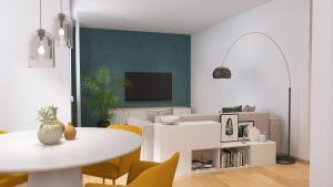 un soggiorno con tavolo bianco e sedie gialle di Apartmenthaus am Kaiser-Wilhelm-Park a Detmold
