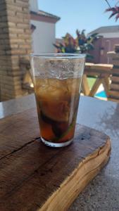 a drink in a cup sitting on a wooden table at Mi Deseo in Sanlúcar de Barrameda