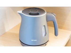 a tea kettle sitting on top of a table at Hotel Torifito Miyakojima Resort - Vacation STAY 79486v in Miyako-jima