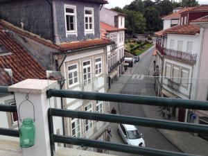 a view of a city street from a balcony at Terraço da Vila in Ponte de Lima