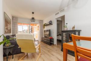 a living room with a couch and a table at Casa Carmen in Málaga