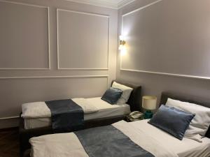 Postel nebo postele na pokoji v ubytování Hotel Balkan Centar