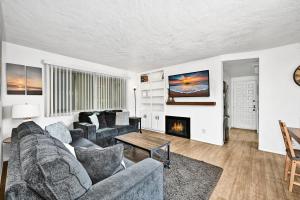 a living room with a couch and a fireplace at Charming 1-Bedroom Home on 29th Street in Newport Beach