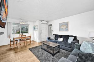 a living room with a couch and a table at Charming 1-Bedroom Home on 29th Street in Newport Beach