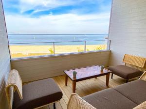 a balcony with a table and a view of the beach at URBAN & BEACH - Vacation STAY 74389v in Awaji