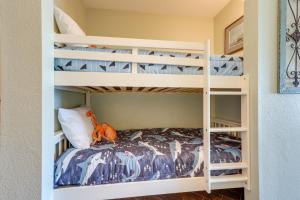 a bunk bed in a room with a bunk bed in a house at Balcony and Gulf Views Galveston Condo Near Beach in Galveston +21 photos