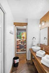 a bathroom with a sink and a mirror at Anastasia Island Condo in Saint Augustine