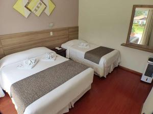 Postel nebo postele na pokoji v ubytování Hotel JB