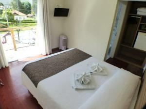 Postel nebo postele na pokoji v ubytování Hotel JB
