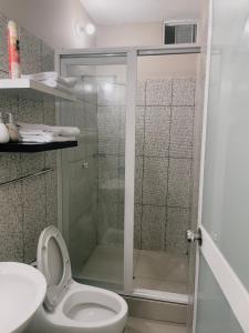 a bathroom with a shower with a toilet and a sink at salome apart in Tarapoto +23 photos