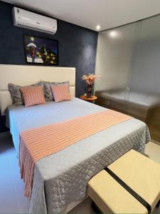 Tempat tidur dalam kamar di Hotel Villa Babaçu