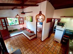 an aerial view of a room with a kitchen at Chalé Centro, Praia Pipa in Pipa