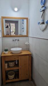 a bathroom with a sink and a mirror at Casa en Paso De La Patria in Paso de la Patria