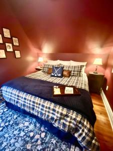 a bedroom with a bed with a tray on it at MacFie House in Cape Girardeau