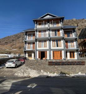 a building with a car parked in front of it at The Bulevar - Whispering Willows in Sissu