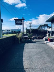 a street sign on the side of a street at Clyde Suite in Tauranga