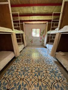 Postel nebo postele na pokoji v ubytování Hacienda Venecia Hostel