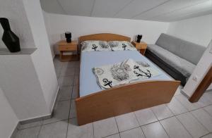 Postel nebo postele na pokoji v ubytování Apartment TinaTeo, Gajac