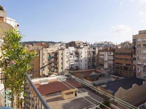 a view of a city from a balcony at 52ROC1069 - New 2BR Flat near Plaza Espana in Barcelona