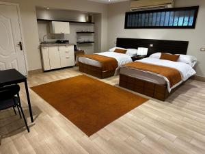 A bed or beds in a room at Rentrific