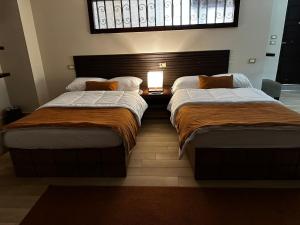 A bed or beds in a room at Rentrific