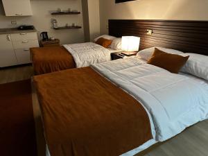 A bed or beds in a room at Rentrific