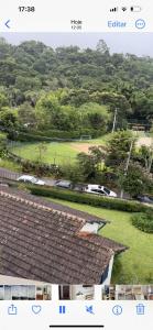 a view of a golf course from the roof of a house at Apartamento Centro ao lado do Country Club in Nova Friburgo