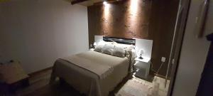 a bedroom with a bed and a mirror at Angeles in La Paloma