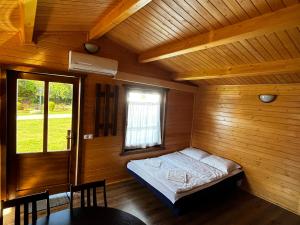 Säng eller sängar i ett rum på Szépasszony Guest House