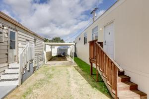 an alleyway between two buildings with a garage at Oak View Home with Private Covered Patio! in Oak View