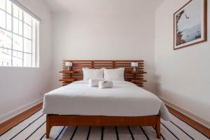 سرير أو أسرّة في غرفة في Breezy 2BR in Polanco