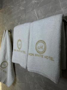 two towels on a towel rack in a hotel room at Mon Invite Hotel in Yerevan