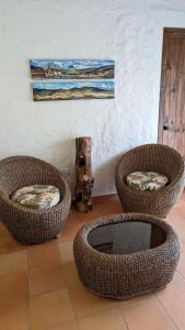 three baskets sitting on the floor in a room at Cabañas Nazak Lago 1 in Pereira