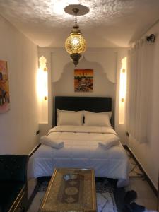 Postel nebo postele na pokoji v ubytování Riad Orient Palace