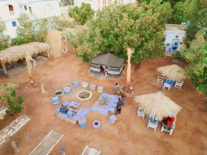 an aerial view of a tent with a table and chairs at Elrayga Camp Dahab in Dahab