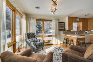 a living room with two couches and a kitchen at Walk to Lake Beach Glenwood Vacation Rental! in Glenwood