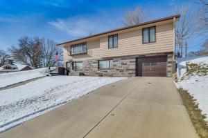 a house with a driveway in the snow at Walk to Lake Beach Glenwood Vacation Rental! in Glenwood