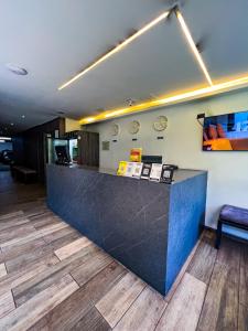 a lobby with a blue counter top in a room at Hotel 47 Medellin Center in Medellín