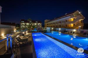 an image of a swimming pool at night at Lofts Complejo Playa Mar in Portonovo