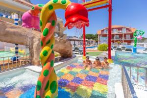 a pool at a resort with a water park at Lofts Complejo Playa Mar in Portonovo